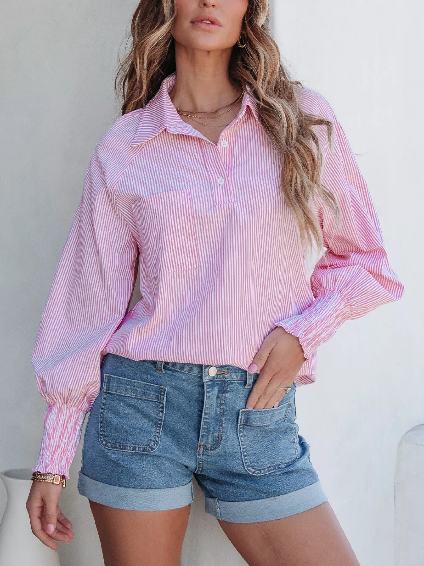 Simmer & Fay pink pinstripe long sleeve blouse with shirt collar, button placket, and smocked cuffs