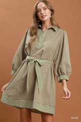 Simmer & Fay – model wearing Umgee olive striped contrast belted puff sleeve mini dress with collar and tie belt