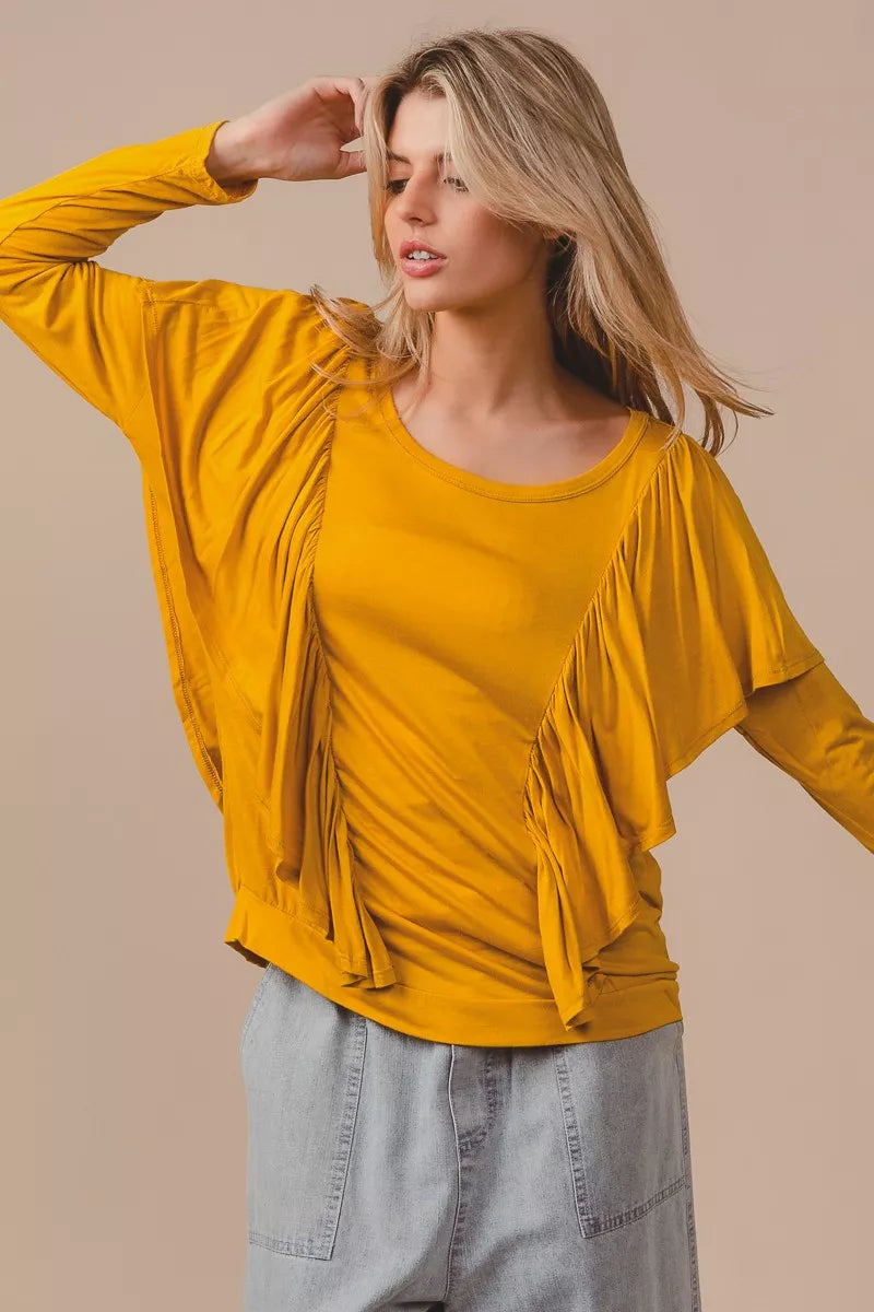 Simmer & Fay mustard yellow Bibi jersey knit top with cascade shoulder ruffle, long sleeves, soft drape