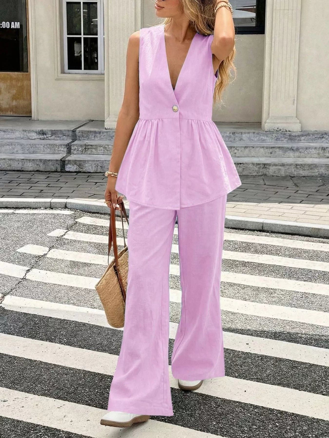Simmer & Fay V-neck sleeveless peplum top and wide-leg pants set in pink, two-piece outfit