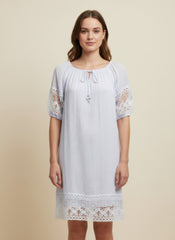 Simmer & Fay - model wearing Mlle Gabrielle solid short sleeve dress with notch elastic neckline and lace sleeve/hem trim