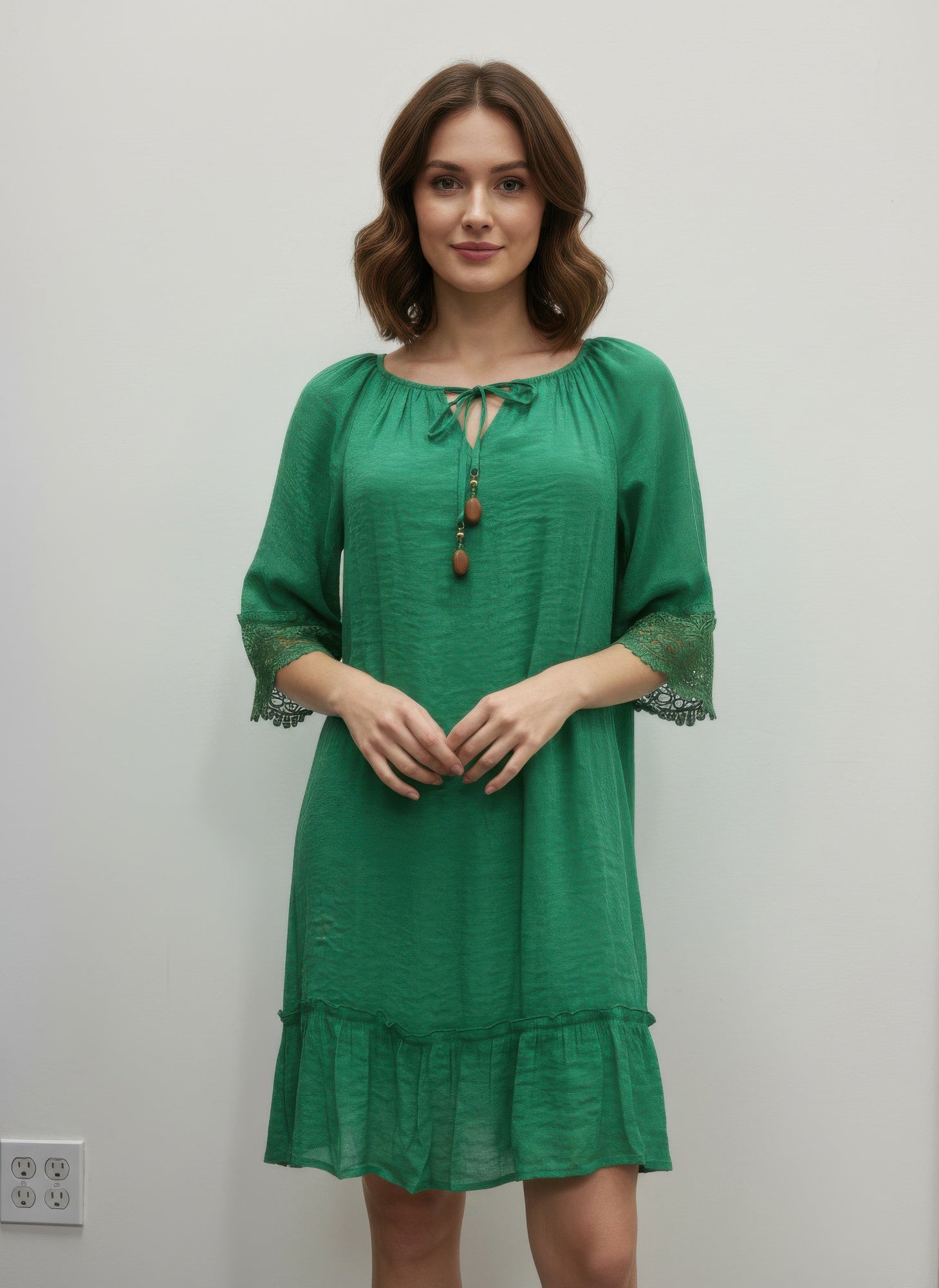 Simmer & Fay – model wearing Mlle Gabrielle solid green elbow sleeve dress with crochet sleeve trim and notch elastic neckline