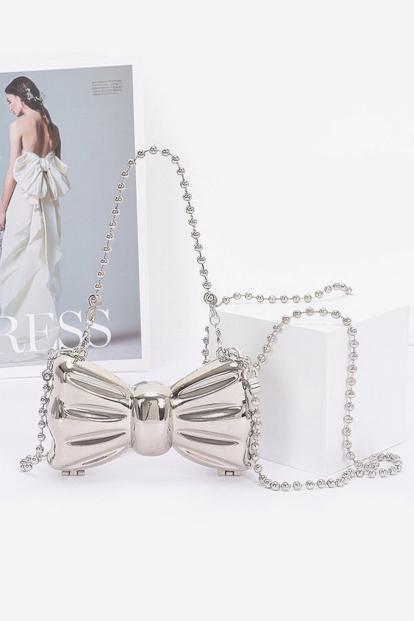 Bow Metal Mini Clutch Simmer & Fay Silver