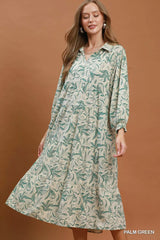 Simmer & Fay – model wearing Umgee palm green linen botanical print tiered midi dress with long sleeves